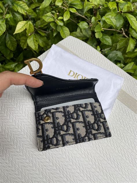 dior saddle flap card holder price|authentic Dior monogram wallet.